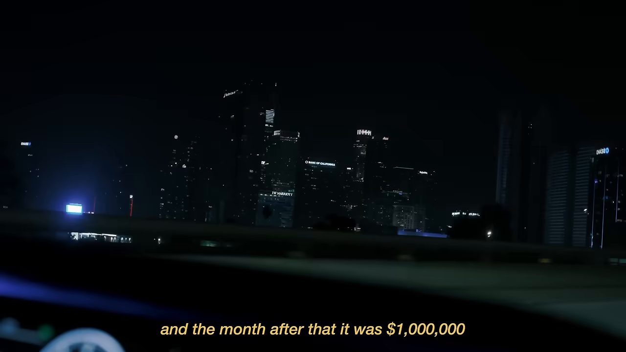 야간 도시 배경에 뜬 자막 "and the month after that it was $1,000,000" — 50만 달러의 다음 달이 100만 달러였다는 순간